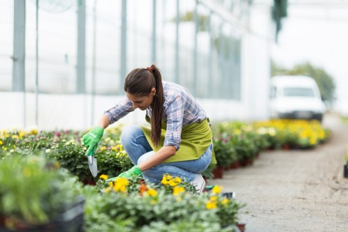 Professional gardeners completing work with attention to health and safety